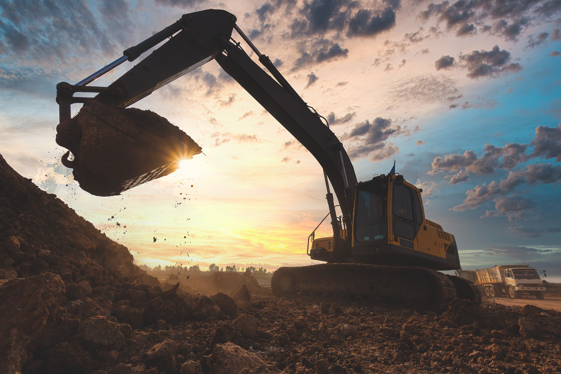 https://www.heritagewastesolutions.com/wp-content/uploads/2022/01/backhoe_loading_soil.jpg