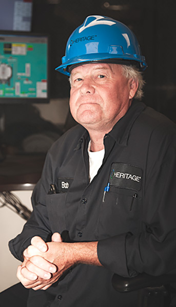 employee sitting in front of computers